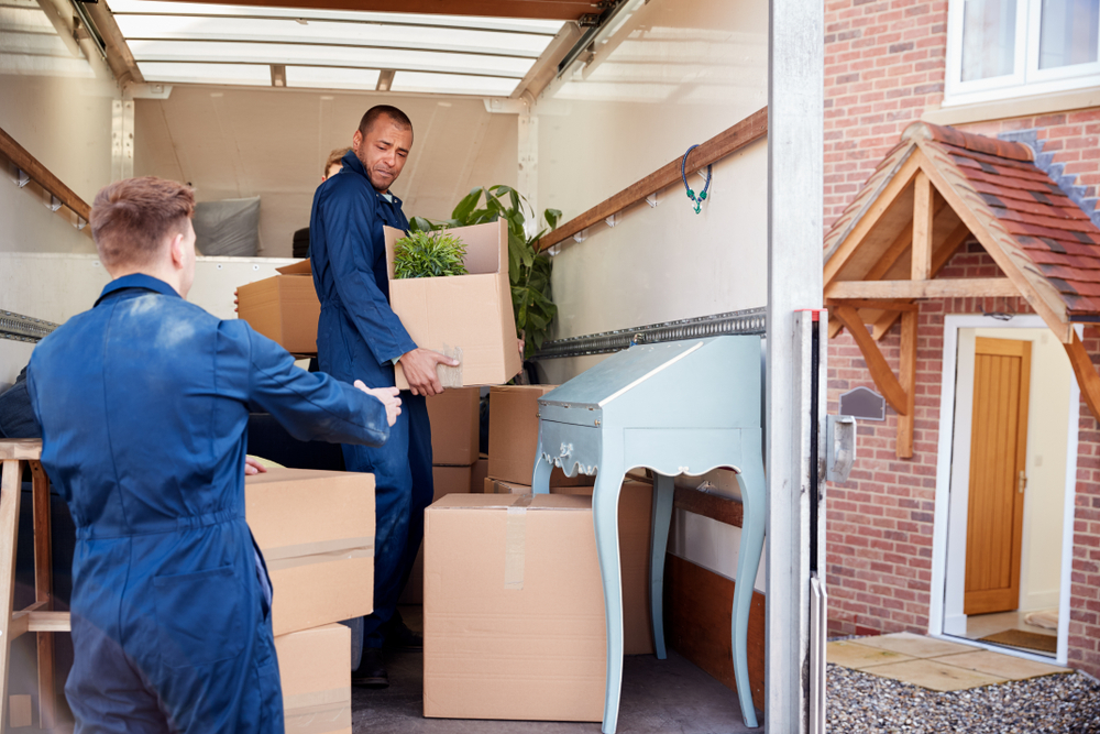 long distance movers loading a moving truck with boxes.